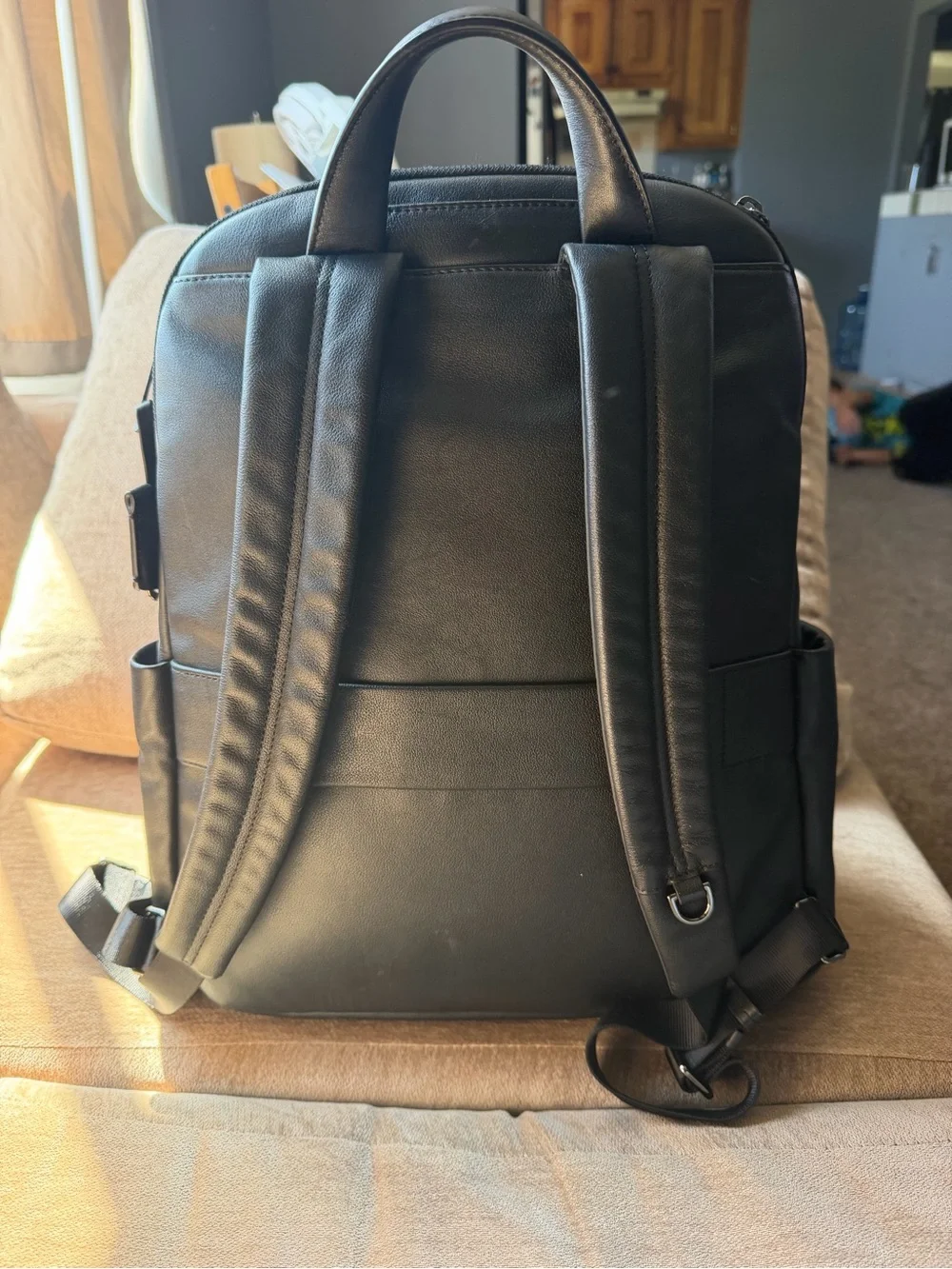 Tumi Black Leather Men's Backpack with Front Zip Pocket